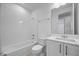 Full bathroom showcasing tiled shower-tub, toilet, and vanity with gold hardware at 15060 Brodie Ln, Winter Garden, FL 34787