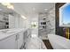 Luxurious bathroom with double vanity, freestanding tub and a glass shower with marble tile at 15060 Brodie Ln, Winter Garden, FL 34787