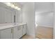 A half-bath with a large mirror, stylish vanity, and an open view to another room at 15060 Brodie Ln, Winter Garden, FL 34787