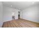Bright bedroom with wood floors leading to ensuite bathroom and kitchen at 15060 Brodie Ln, Winter Garden, FL 34787
