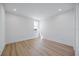 Inviting bedroom featuring light wood flooring, white walls, a window, and recessed lighting at 15060 Brodie Ln, Winter Garden, FL 34787