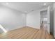 Spacious bedroom showcasing light wood floors and neutral walls, bathed in natural light at 15060 Brodie Ln, Winter Garden, FL 34787