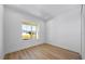 Cozy room with hardwood floors, a large window, and ample natural light at 15060 Brodie Ln, Winter Garden, FL 34787