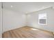 Well-lit bedroom featuring wood floors and a window with a view at 15060 Brodie Ln, Winter Garden, FL 34787