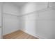 Spacious walk-in closet featuring wire shelving and wood-look flooring at 15060 Brodie Ln, Winter Garden, FL 34787