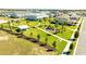 A view of the neighborhood community park with a playground, pavilion, and lush green space at 15060 Brodie Ln, Winter Garden, FL 34787