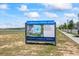 A prominent community sign advertises 'Clubhouse Coming Soon' with images of planned amenities at 15060 Brodie Ln, Winter Garden, FL 34787