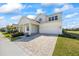 Beautiful two-story home with a spacious two-car garage and a meticulously paved driveway at 15060 Brodie Ln, Winter Garden, FL 34787