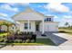 Charming two-story home with a well-manicured lawn, stylish landscaping, and a welcoming front porch at 15060 Brodie Ln, Winter Garden, FL 34787