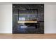 Stunning black marble fireplace with contemporary design and ambient lighting at 15060 Brodie Ln, Winter Garden, FL 34787
