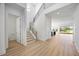 Spacious foyer featuring hardwood floors, a modern staircase, and an open layout to the living areas at 15060 Brodie Ln, Winter Garden, FL 34787