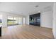 Spacious living room boasts sleek marble fireplace, recessed lighting, and sliding doors to outdoor patio at 15060 Brodie Ln, Winter Garden, FL 34787