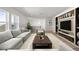Spacious living room with modern finishes, comfortable seating, built-in shelving, and natural light at 15060 Brodie Ln, Winter Garden, FL 34787