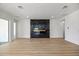 Bright living room featuring modern fireplace, recessed lighting, and spacious layout at 15060 Brodie Ln, Winter Garden, FL 34787