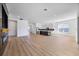 Bright, open-concept space with living room, kitchen, and sleek marble fireplace at 15060 Brodie Ln, Winter Garden, FL 34787
