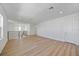 Spacious loft area featuring wood floors, modern lighting, and a sleek railing at 15060 Brodie Ln, Winter Garden, FL 34787