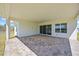 Covered outdoor patio featuring brick flooring, ideal for entertainment and relaxation at 15060 Brodie Ln, Winter Garden, FL 34787