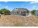 Backyard featuring a screened-in pool area at 15746 Autumn Glen Ave, Clermont, FL 34714
