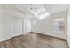 Bright bedroom featuring vaulted ceiling, a ceiling fan, new flooring, and a closet at 15746 Autumn Glen Ave, Clermont, FL 34714