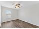 Bright bedroom with neutral walls, ceiling fan, and window offering ample natural light at 15746 Autumn Glen Ave, Clermont, FL 34714