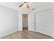 Bedroom with closet, neutral colors, ceiling fan, and easy access to other rooms at 15746 Autumn Glen Ave, Clermont, FL 34714