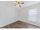 Bright bedroom with natural light, ceiling fan, and neutral walls, perfect for personalization at 15746 Autumn Glen Ave, Clermont, FL 34714