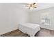 Cozy bedroom with neutral walls, featuring a window and a comfortable bed, great for relaxation at 15746 Autumn Glen Ave, Clermont, FL 34714