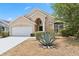 Charming single-story home with a well-maintained front yard and attached two-car garage at 15746 Autumn Glen Ave, Clermont, FL 34714