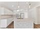 Modern kitchen with stainless steel appliances and light wood flooring at 15746 Autumn Glen Ave, Clermont, FL 34714