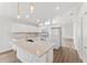 Bright, open kitchen with modern fixtures and stainless steel appliances at 15746 Autumn Glen Ave, Clermont, FL 34714