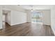 Bright living room featuring a ceiling fan, sliding glass doors to the pool area, and new flooring at 15746 Autumn Glen Ave, Clermont, FL 34714