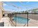 Sparkling pool with protective fencing within screened enclosure, perfect for relaxation and fun at 15746 Autumn Glen Ave, Clermont, FL 34714