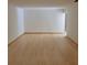 A bright living room with hardwood flooring and neutral colored walls at 1661 Votaw Rd, Apopka, FL 32703