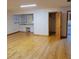 Spacious living room with wood floors, wet bar, and large windows at 1661 Votaw Rd, Apopka, FL 32703
