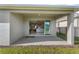 The covered back porch transitions seamlessly to an interior view with sliding glass doors at 19318 Banfield Pl, Orlando, FL 32827