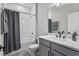 Modern bathroom featuring a vanity, a soaking tub with shower and white subway tile at 19318 Banfield Pl, Orlando, FL 32827