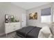 Cozy bedroom with neutral tones, decorative prints, and modern furniture at 19318 Banfield Pl, Orlando, FL 32827