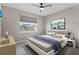 Cozy bedroom with a large window and a calm, neutral color palette at 19318 Banfield Pl, Orlando, FL 32827