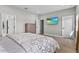 Bright bedroom features a mounted television and neutral decor at 19318 Banfield Pl, Orlando, FL 32827