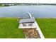 Scenic lake view with dock access, gazebo, and green space for community enjoyment at 19318 Banfield Pl, Orlando, FL 32827