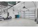 Spacious three-car garage featuring a durable epoxy floor, providing ample parking and storage space at 19318 Banfield Pl, Orlando, FL 32827