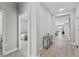Bright hallway with light floors, connecting various rooms in the home at 19318 Banfield Pl, Orlando, FL 32827