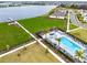 Community pool and green space overlooking a beautiful lake in a residential neighborhood at 19318 Banfield Pl, Orlando, FL 32827
