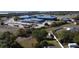 Overhead image of school grounds, bus depot and ball fields located near a residential area at 1956 Myakka Ct, Poinciana, FL 34759