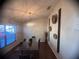 Bright dining room with a modern chandelier, decorative wall hangings, and a glass-topped table at 1956 Myakka Ct, Poinciana, FL 34759