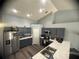 Bright kitchen with stainless steel appliances, plenty of counter space, and sleek cabinetry at 1956 Myakka Ct, Poinciana, FL 34759