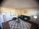 Stylish living room features a plush rug, modern furniture, and complementary decor for a cozy atmosphere at 1956 Myakka Ct, Poinciana, FL 34759