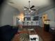 Open-concept living area flows into a well-equipped kitchen, offering a seamless space for entertaining and everyday living at 1956 Myakka Ct, Poinciana, FL 34759