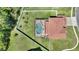 Aerial view of property showcasing fenced yard and screened pool at 2629 Maggiore Cir, Kissimmee, FL 34746