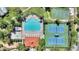 Overhead shot of community pool with sundeck, tennis and basketball courts offers resort-style recreation at 2629 Maggiore Cir, Kissimmee, FL 34746